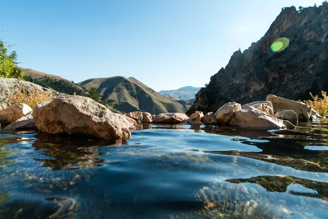 A natural hot spring pool overlooking the Idaho mountains at Goldbug Hot Springs.