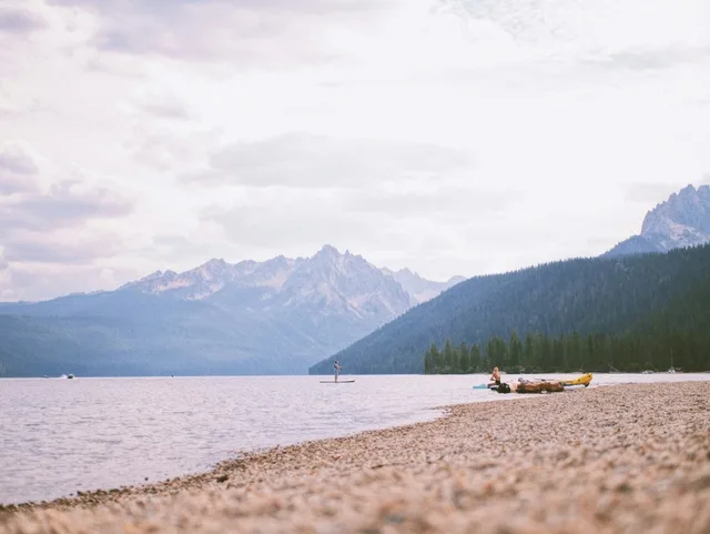 A peaceful view of Redfish Lake with the Sawtooth Mountains in the background.